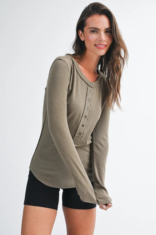 woman in henley top and shorts