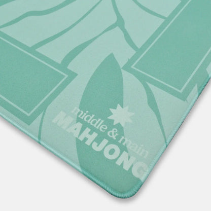 Green Mahjong mat with 'middle & main' branding on a white background