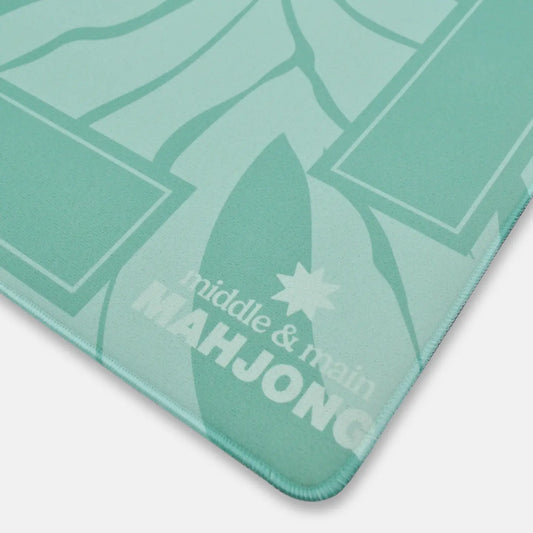 Green Mahjong mat with 'middle & main' branding on a white background