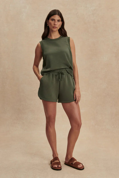 woman earing green shorts and green top 
