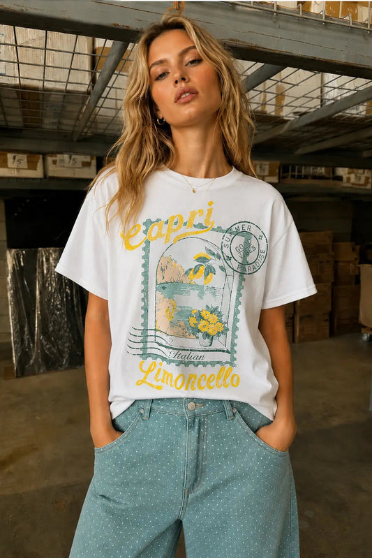 Woman wearing a white t-shirt with a graphic design in an industrial setting