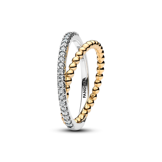 Two Pandora rings shown on a clean white background: one with a row of clear stones and one with a textured gold beaded band, both overlapping to show the inner Pandora branding.