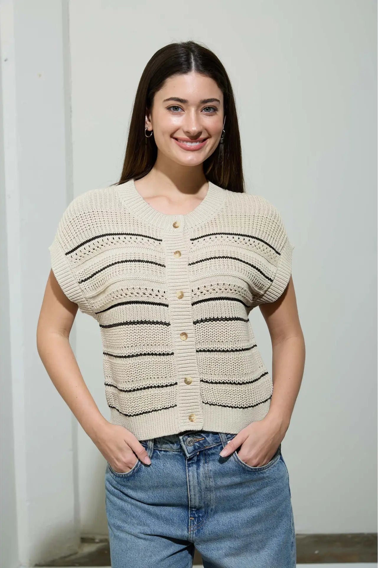 woman wearing multi stripe short sleeve cardigan with jeans