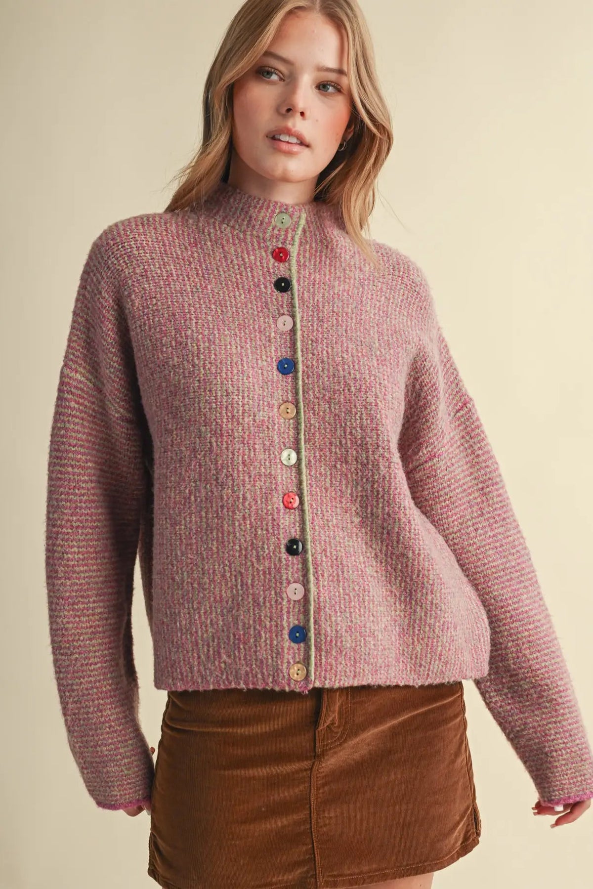 woman in colorful button cardigan and skirt 