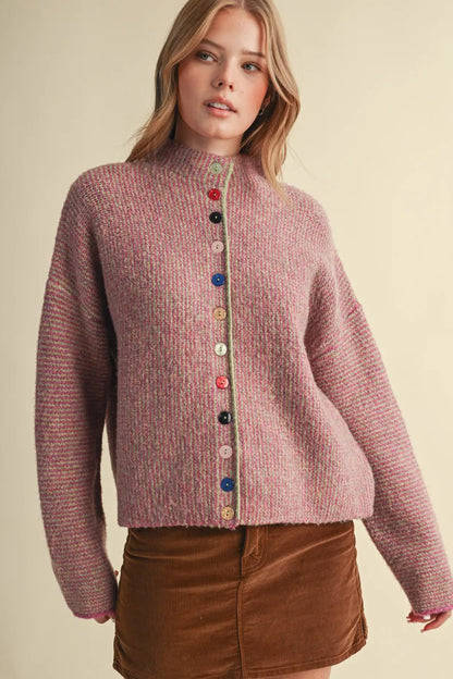 woman in colorful button cardigan and skirt 