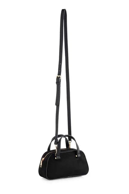 A black dome-shaped handbag with a long shoulder strap, dual top handles, and gold-tone hardware, shown against a plain white background.
