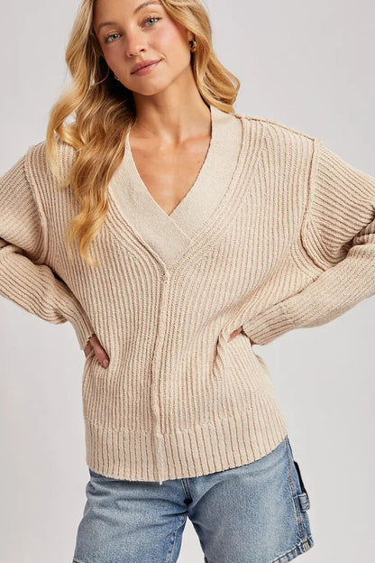 woman in v neck sweater 
