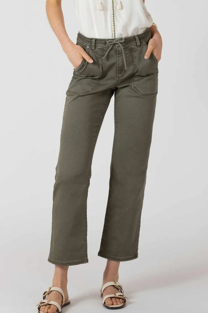 Person wearing olive green pants on a white background