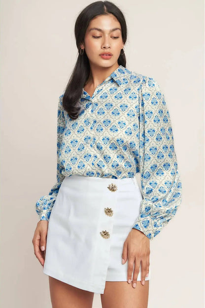 woman wearing blouse with white skort 