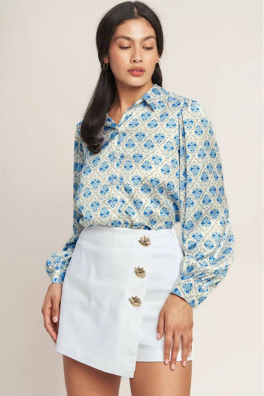 woman wearing blouse with white skort 