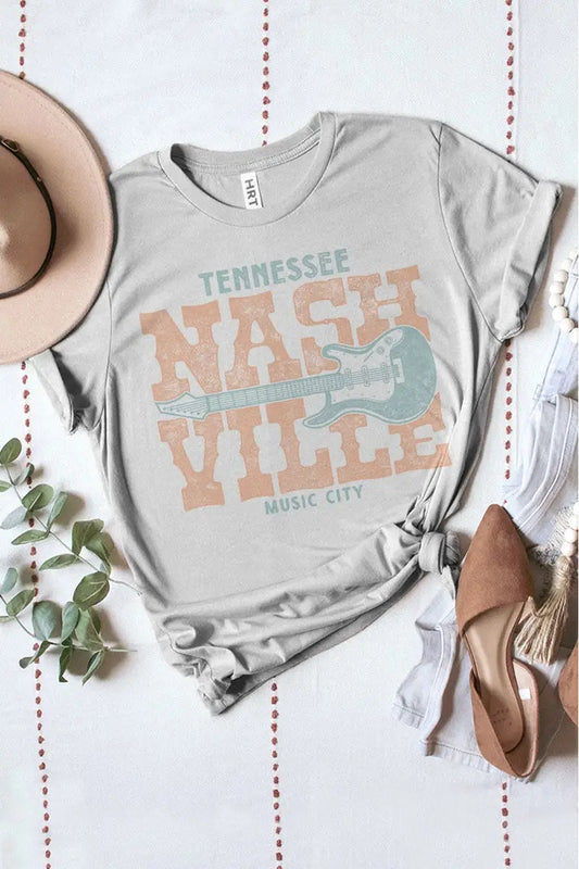 Gray t-shirt with 'Nashville Music City' design on a white background with decorative elements.