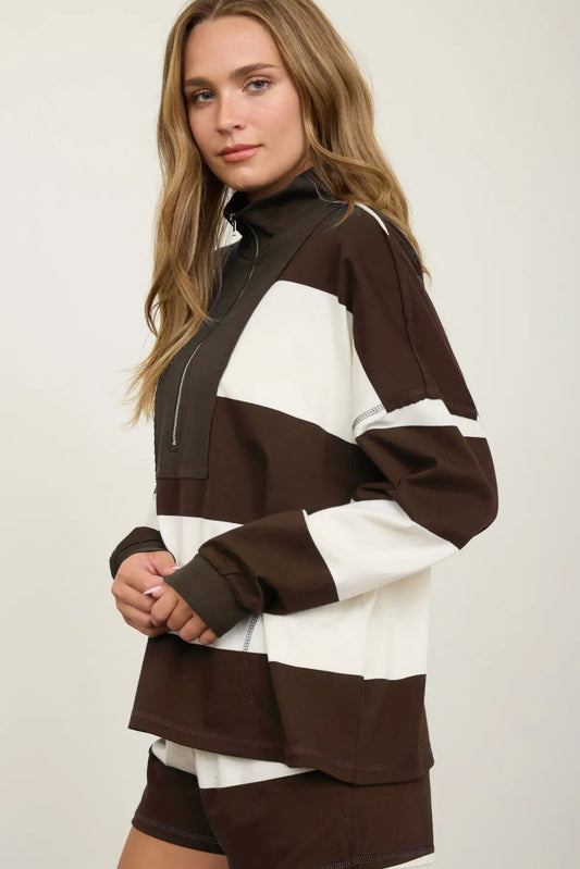 woman in wide stripe half zip pullover