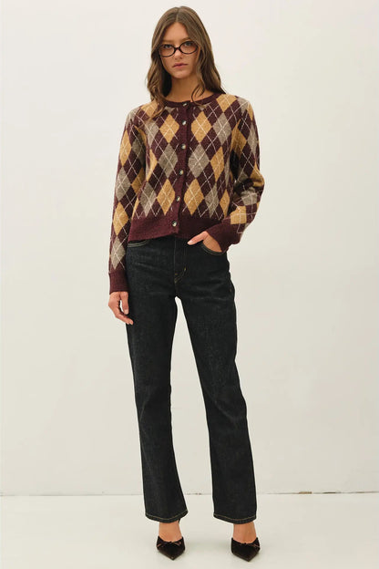 woman in argyle sweater and jeans
