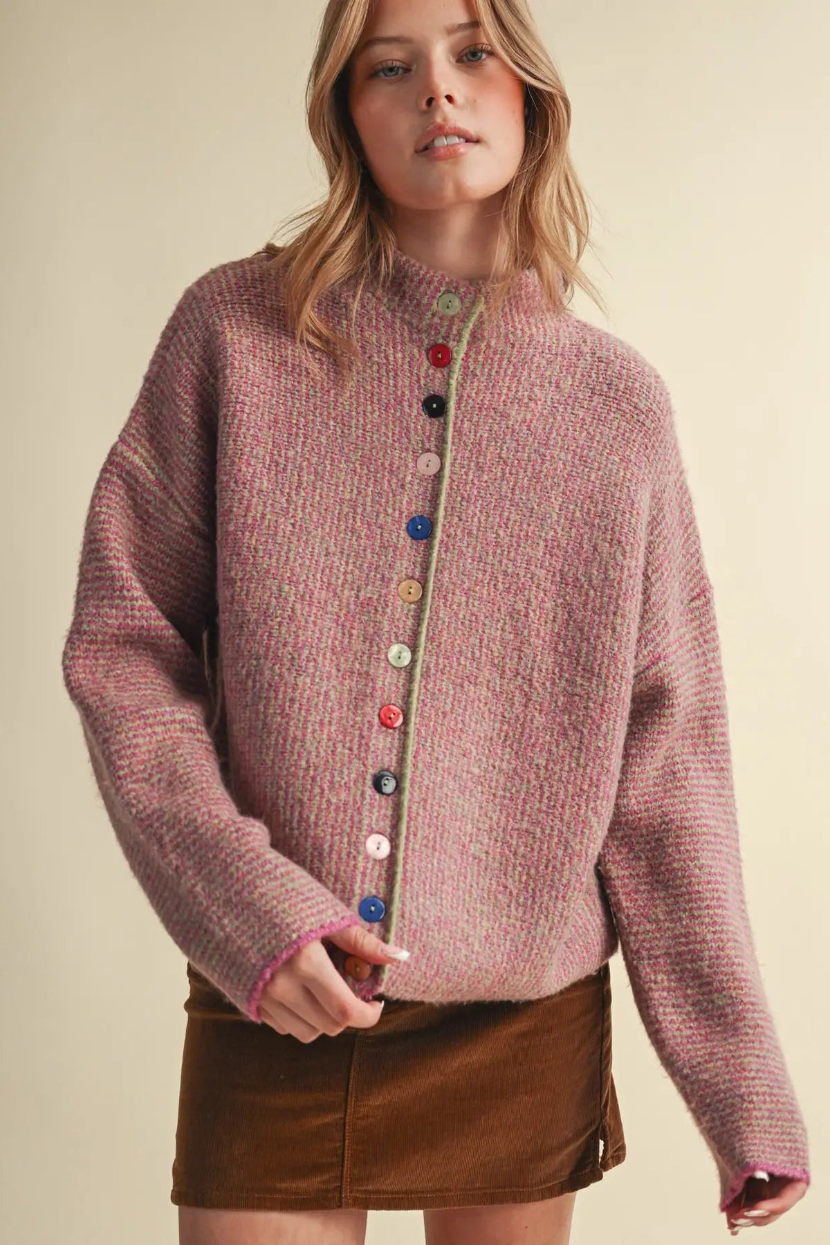 woman in colorful button cardigan and skirt 