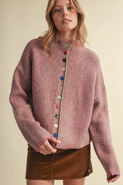 woman in colorful button cardigan and skirt 