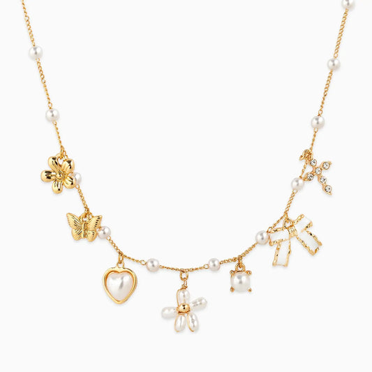 Pearl Flower Multi Charm Necklace on white background