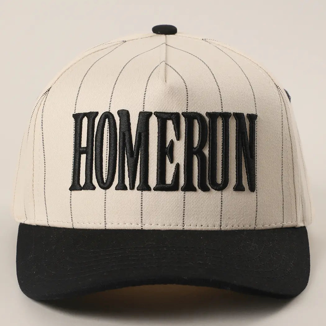 Baseball cap with 'HOMERUN' text on a plain background