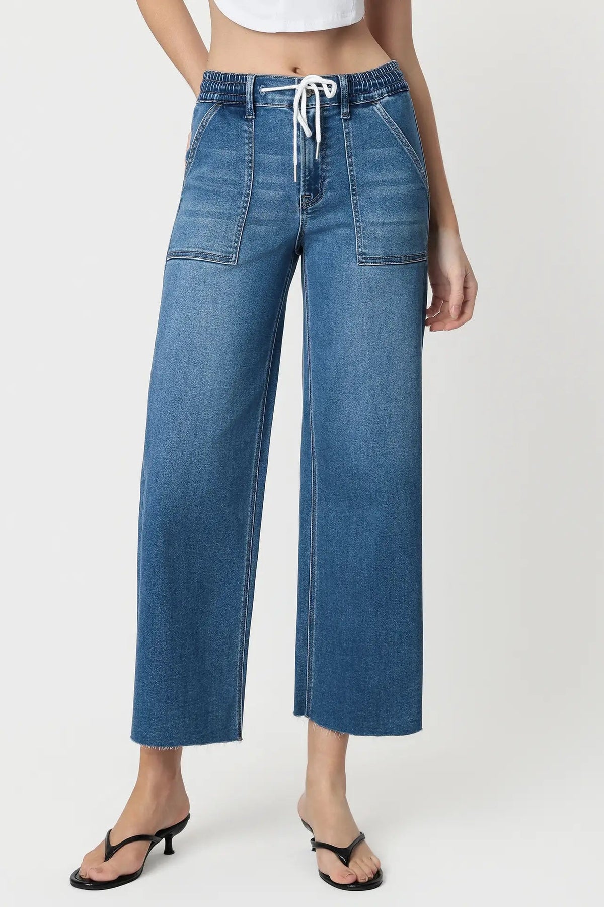 close up of person wearing jeans