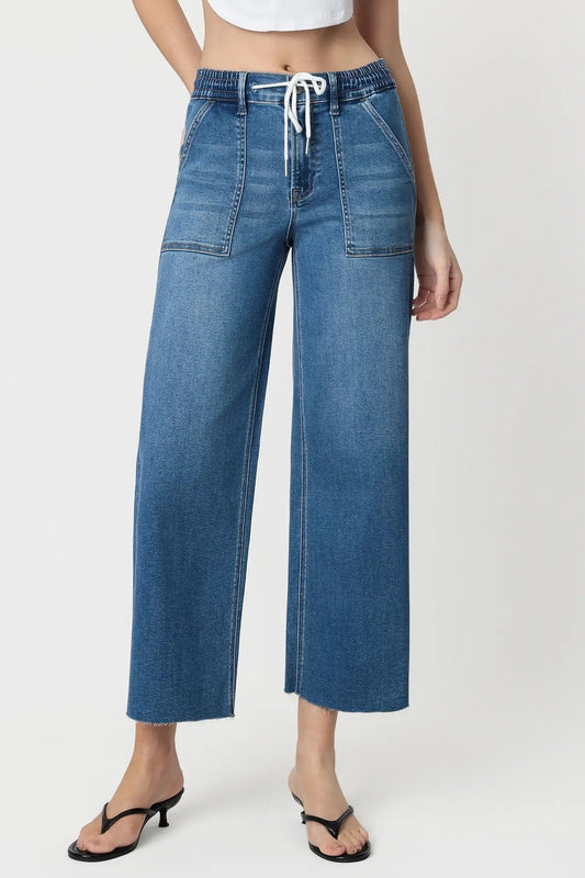 close up of person wearing jeans
