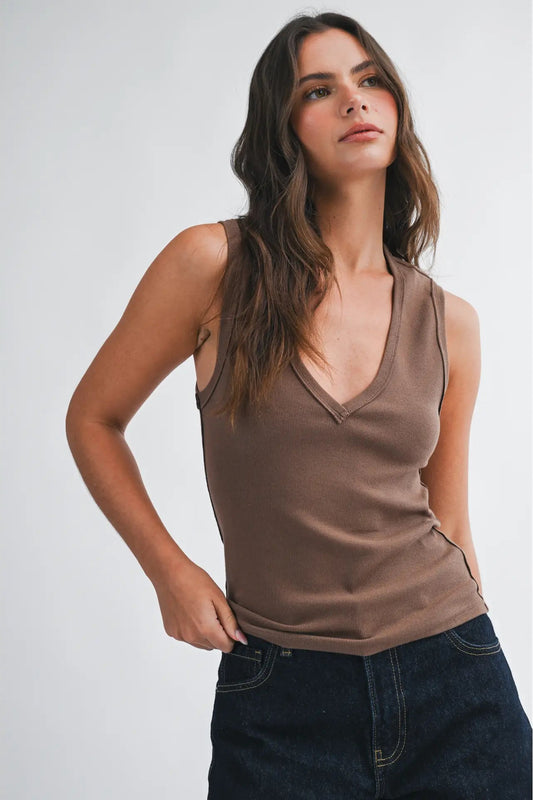 woman wearing tank top with jeans