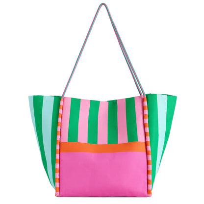 Colorful striped tote bag with a pink front panel on a white background