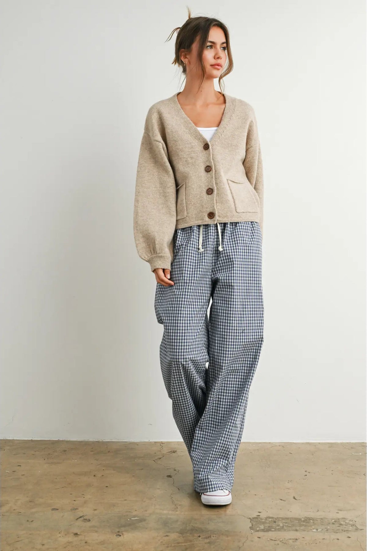 woman in cardi and checkered pants