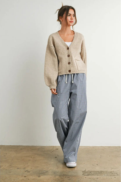 woman in cardi and checkered pants
