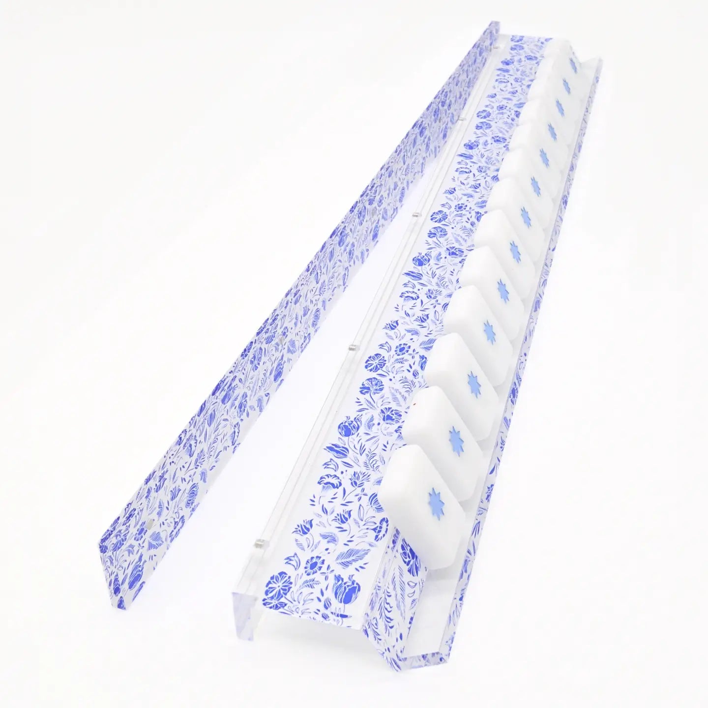 A clear acrylic 6-piece ice cube tray with a blue floral patterned insert, shown on a clean white background.