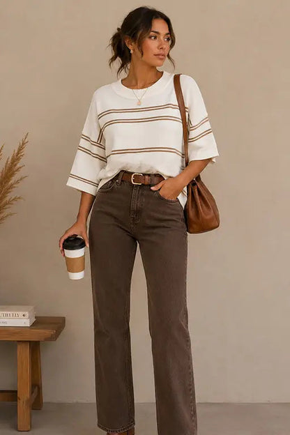 woman in striped sweater and brown pants