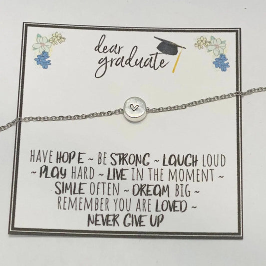 Bracelet with a message card for graduates on a white background