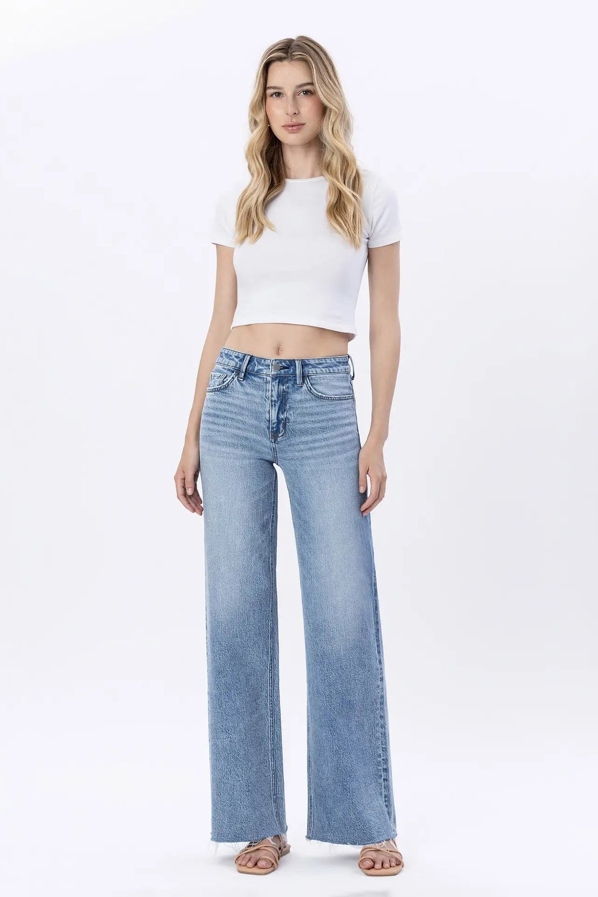 woman in jeans and white top