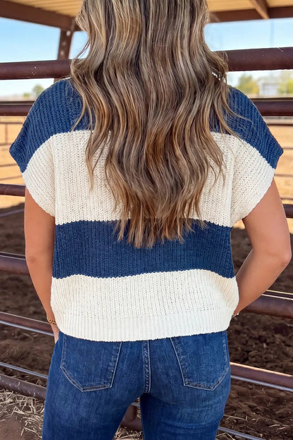 back view of woman in blue and white stripe weater in jeans