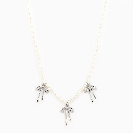 Necklace with silver leaf pendants on a white background