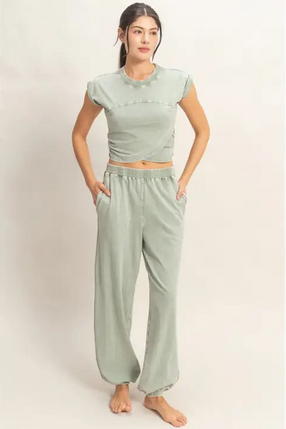 woman wearing green matching jogger set
