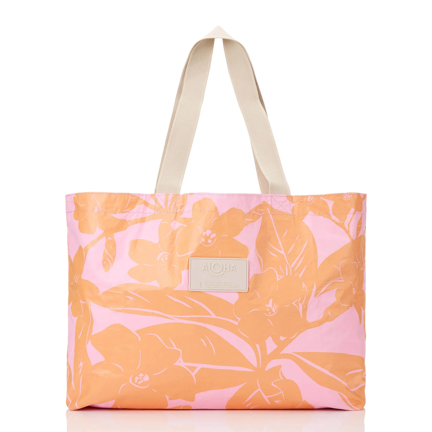 Floral-patterned tote bag with a visible brand label on a white background