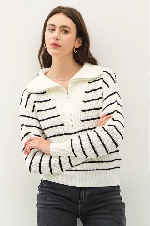 woman in striped half zip pullover