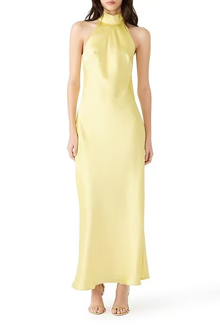 Yellow halter neck gown on a white background
