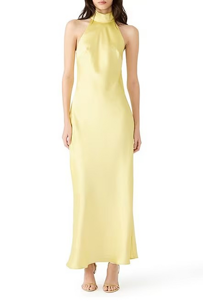 Yellow halter neck gown on a white background