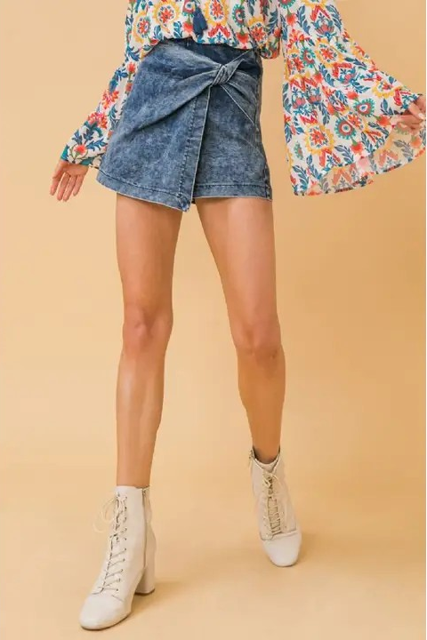 woman wearing denim skirt with blouse