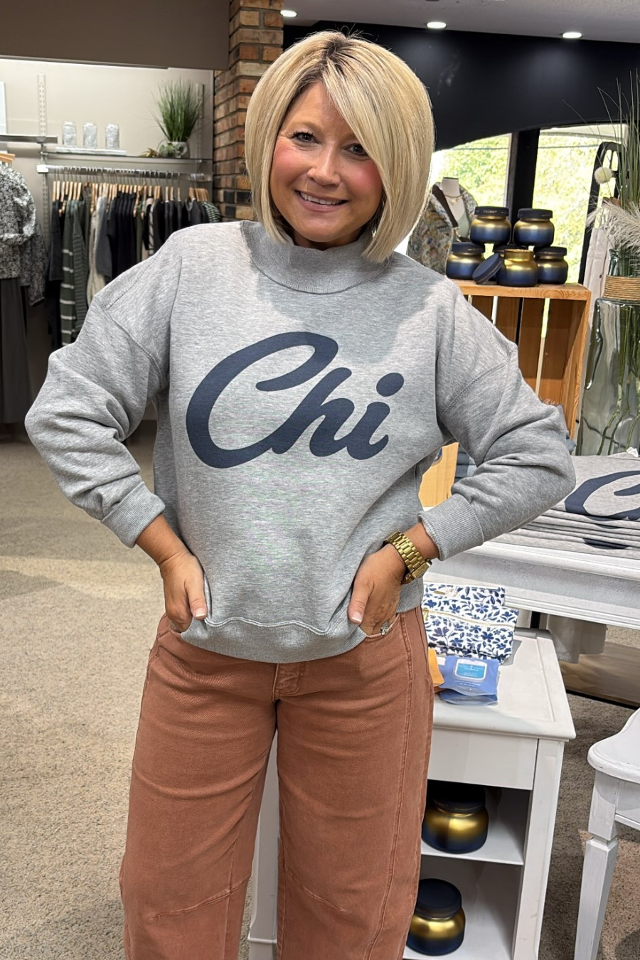 woman wearing mock neck sweatshirt