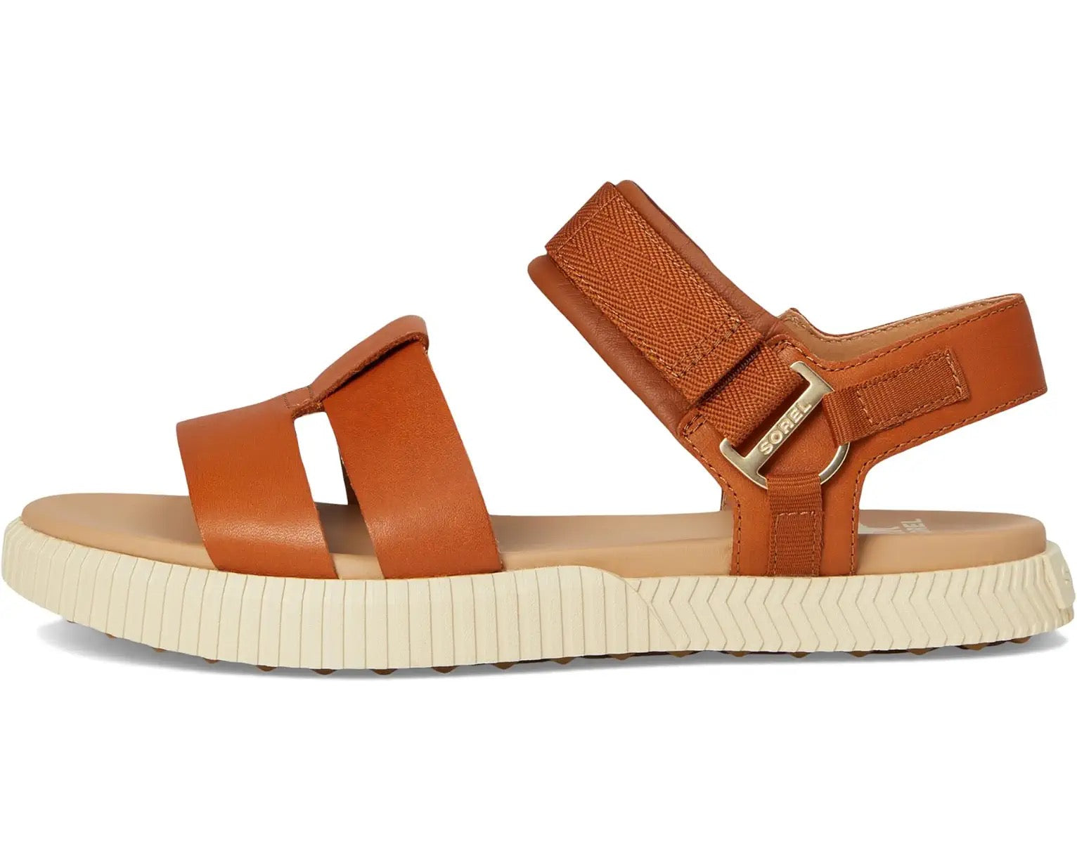 Brown sandal with a strap and buckle on a white background