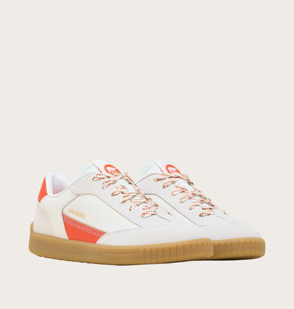 White sneaker with orange accents on a light gray background