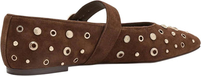 A single brown suede flat shoe with a strap across the top and multiple metallic eyelet embellishments on the side, shown against a plain white background.