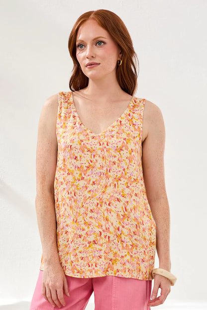 woman wearing floral cami with pink pants