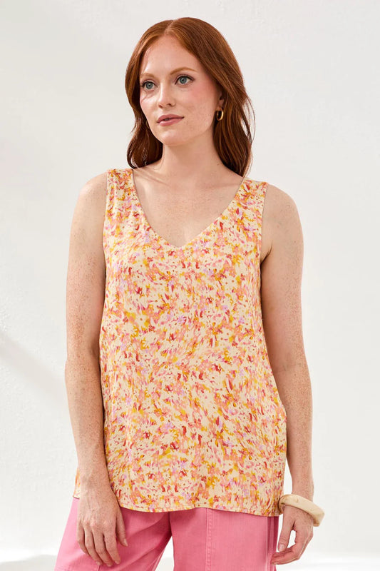 woman wearing floral cami with pink pants