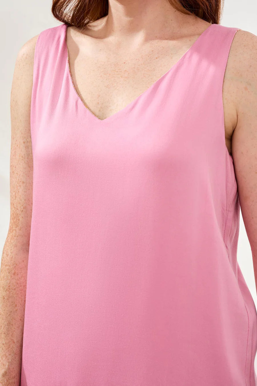woman wearing pink cami with pink pants