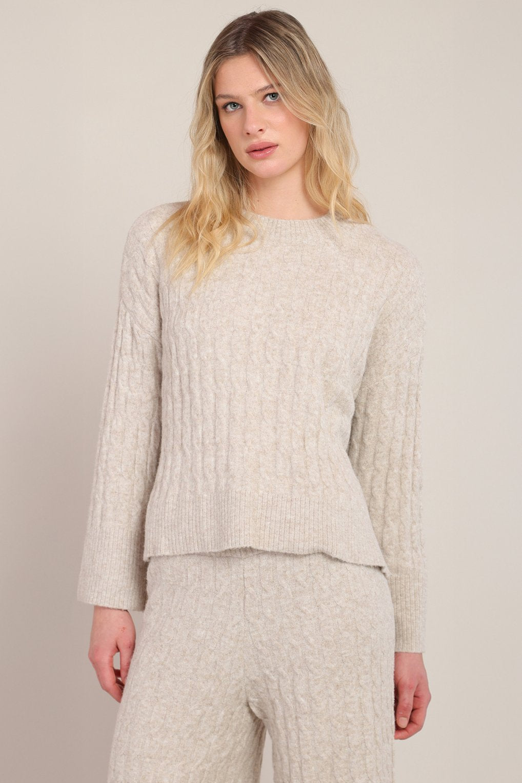 woman wearing sweater and matching pants