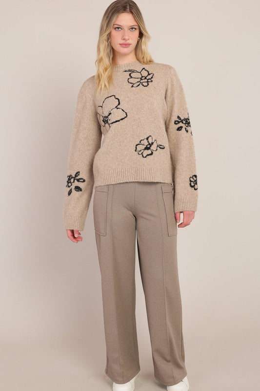 woman wearing floral sweater