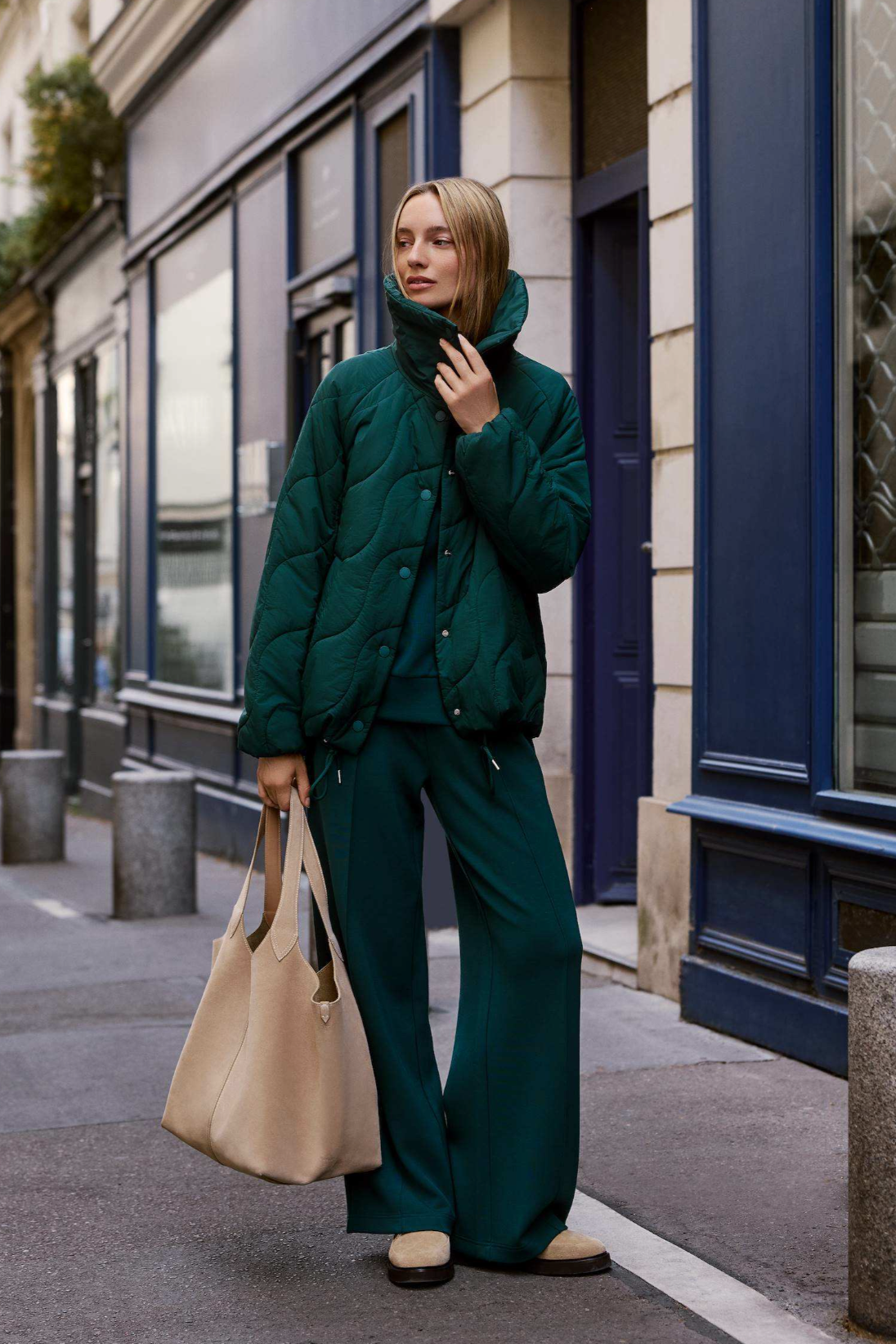 woman wearing coat with pants