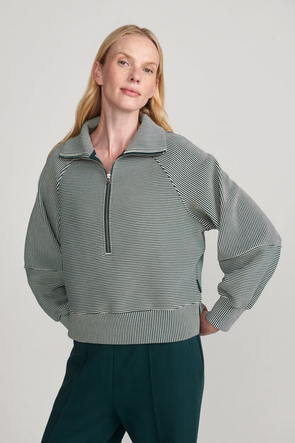 woman wearing green sweatshirt 